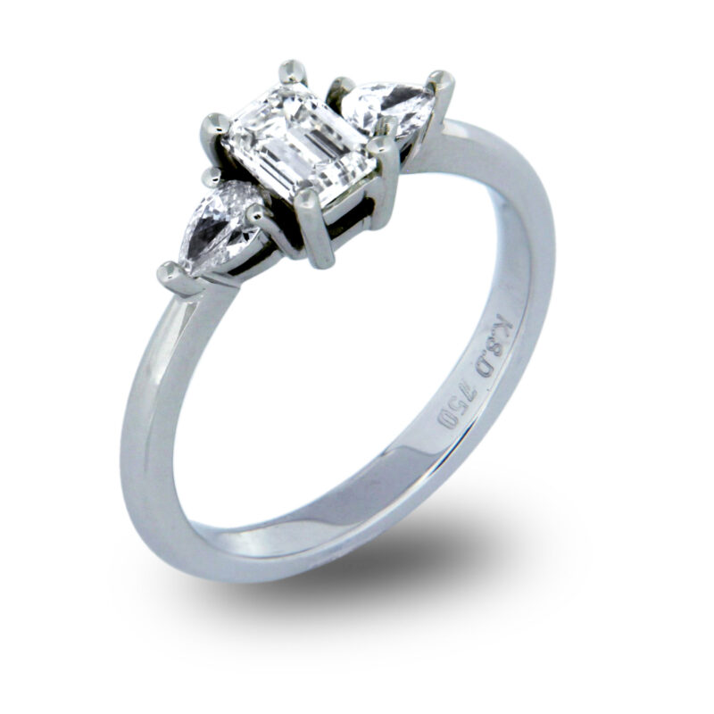 Emerald and Pear Cut Diamond Three Stone Ring
