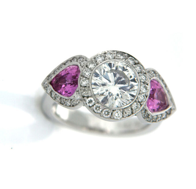 Round Diamond and Pear Pink Sapphire Three Stone Diamond Halo Ring